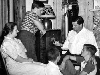 Family Gathered Around the Radio